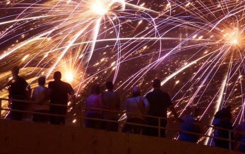 Spectators watch the "Celebration of Freedom" fireworks grand finale from the parking garage between 2nd and 3rd Ave. in downtown Cedar Rapids Sun. July 4, 2004.