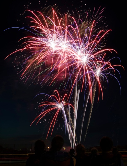 Spectators watch the show during the annual Freedom Fest fireworks display at Kirkwood Community College on Friday, July 4, 2008, in southwest Cedar Rapids. (Jim Slosiarek/The Gazette)